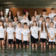 Gruppenfoto der jungen Schwimmerinnen und Schwimmer des Schwimmclub Chur im Hallenbad